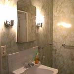 Small full bath right at the back entryway.